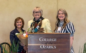 three women smiling at camera